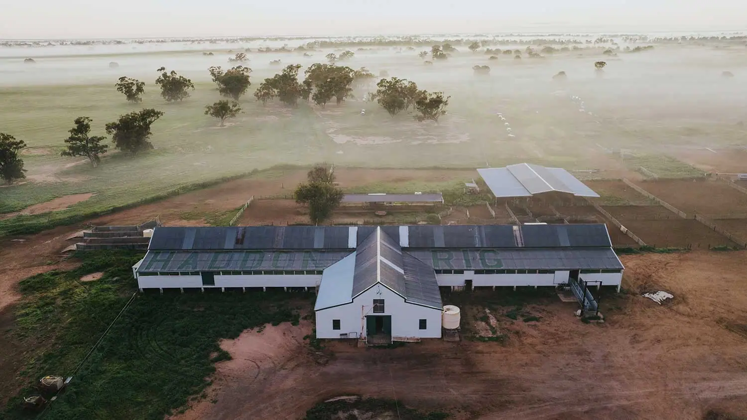 Aerial view of the Haddon Rig woolshed and misty Macquarie River plains