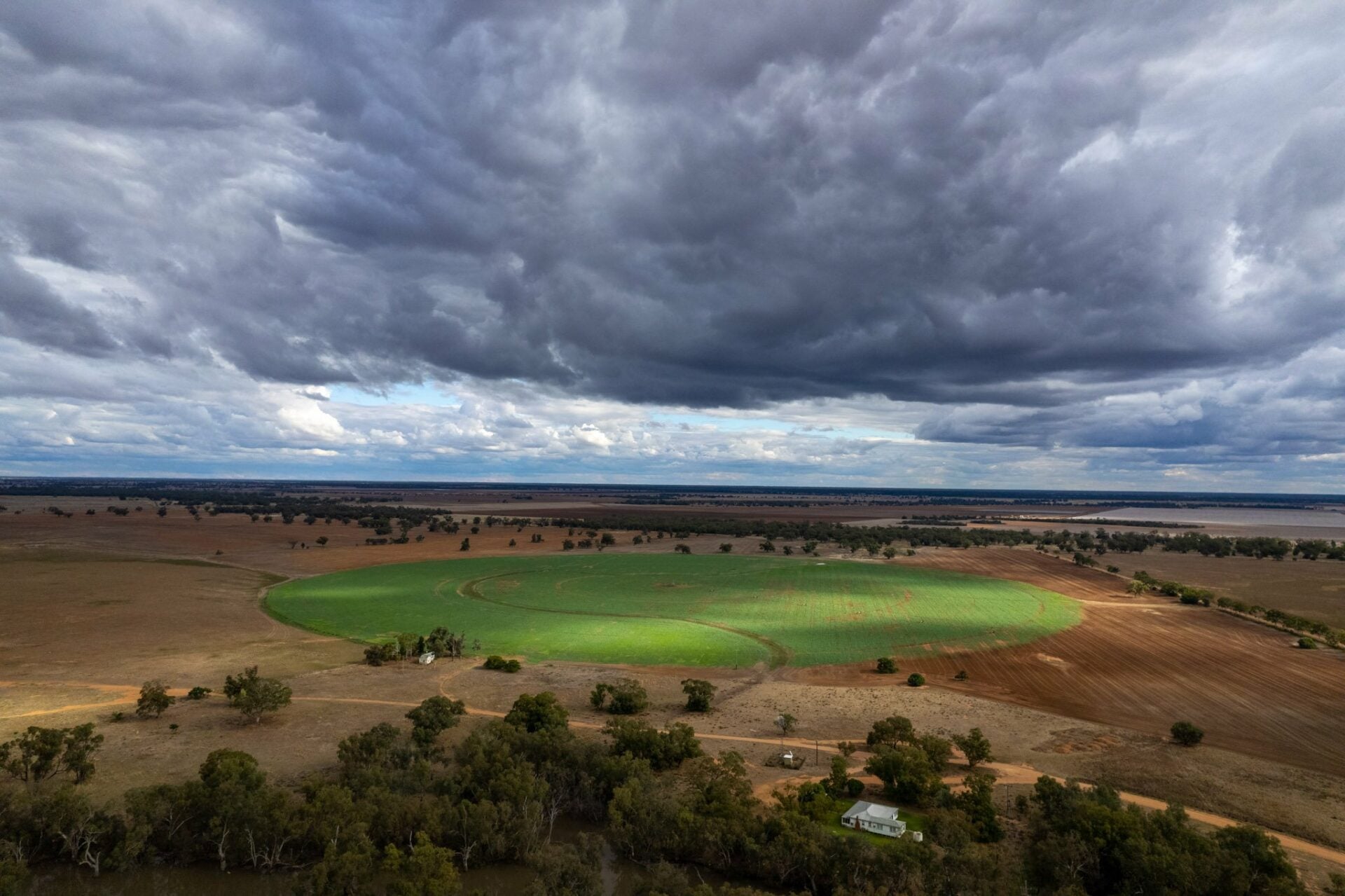 Aerial view of Haddon Rig country and cropping paddocks under storm clouds