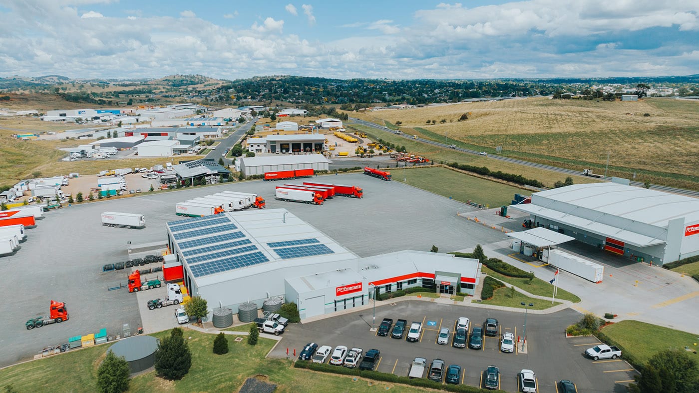 Aerial view of the Ron Finemore Transport depot, truck yard, and surrounding industrial area